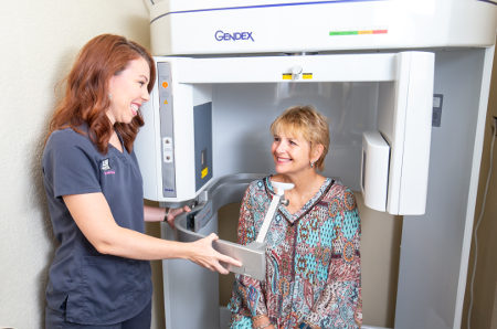 dentist preps patient for cbct scan
