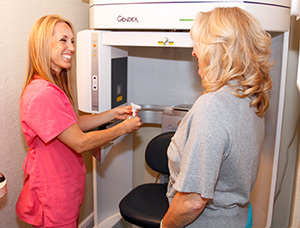 dentist demonstrates cbct scanner