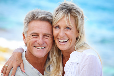 Couple smiling at the beach