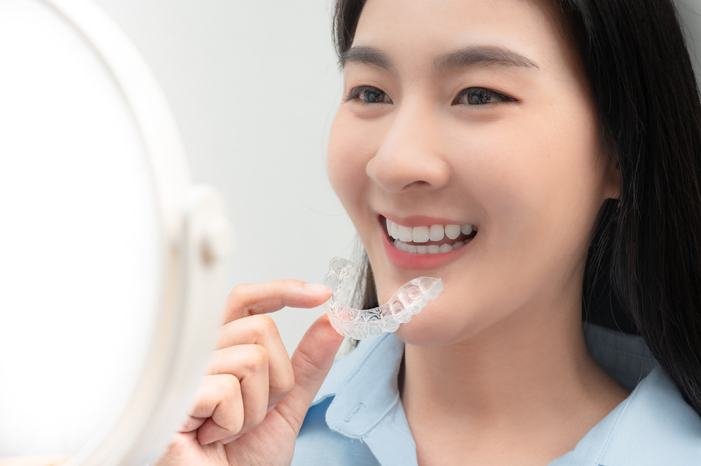 woman about to put in mouthguard