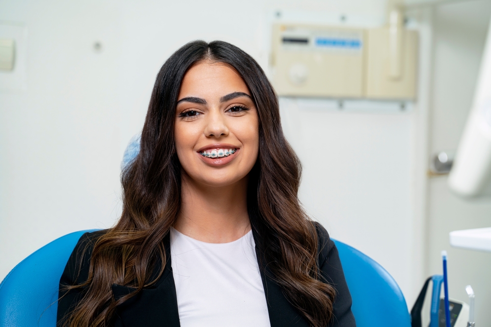 brunette woman sitting in a dental chair