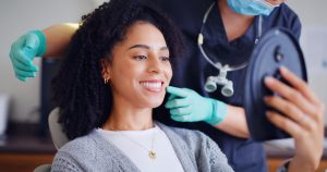 woman smiling at the dentist