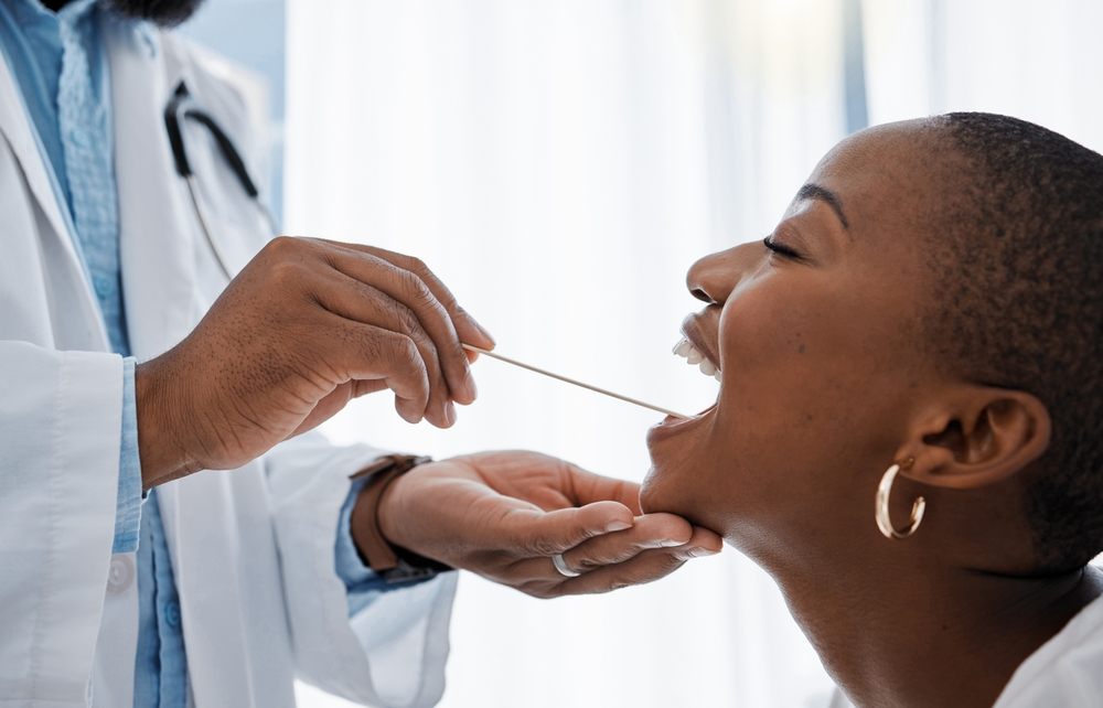 doctor collects oral sample