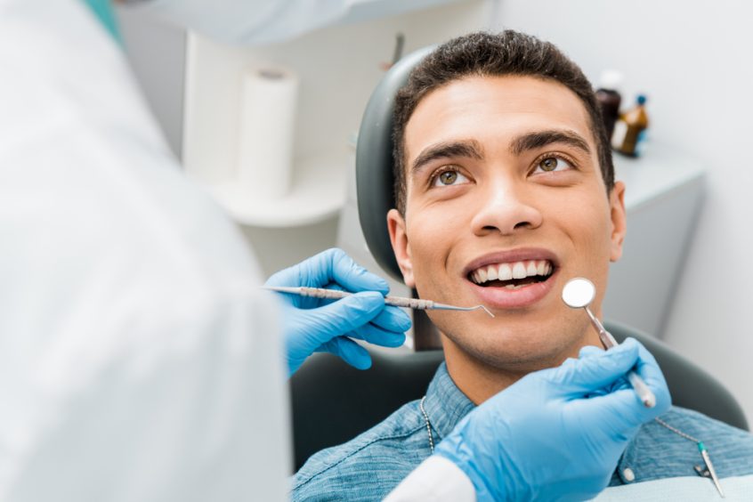 man visiting the dentist for a dental checkup